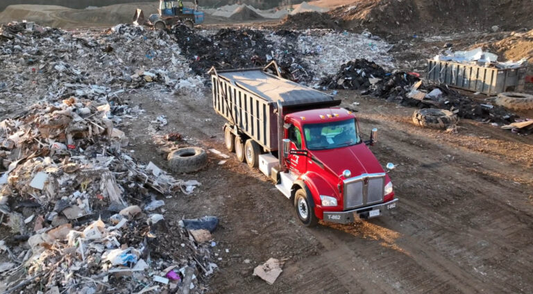 EAI Rolloff truck dumping waste